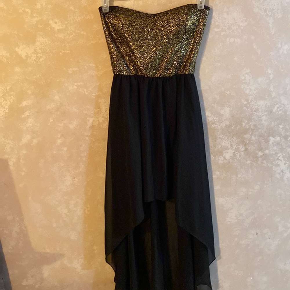 Medium strapless dress with gold top and high low floor length skirt